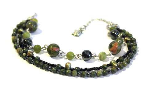 A beautiful bracelet, made with rhyolite, nephrite, unkite, hematite, and fresh water pearls and a turtle charm